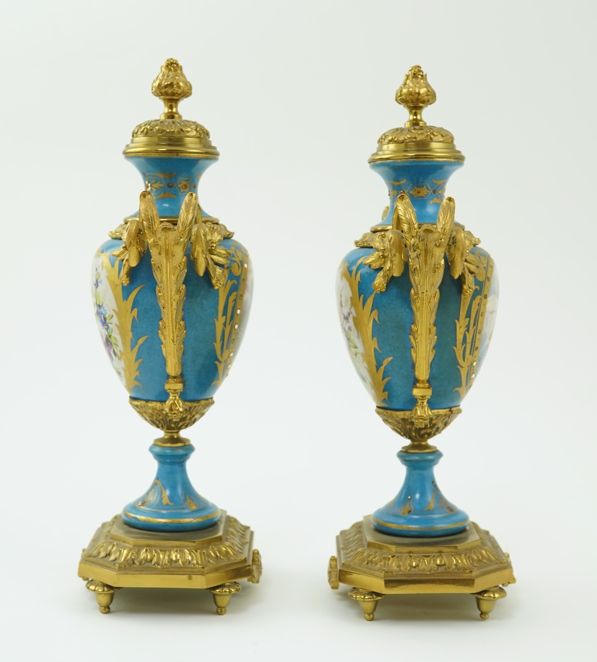 A pair of late 19th century ormolu mounted Sevres style porcelain cassolettes